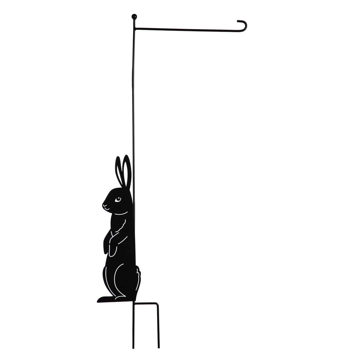 Outdoor garden flag stand with metal laser cut standing bunny silhouette on base of the stand for Easter and spring decor.