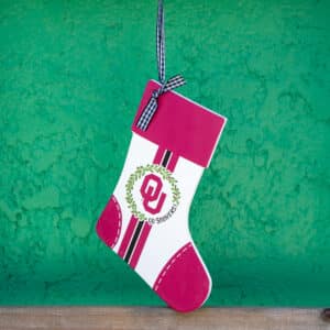University of Oklahoma Red and White Stocking shaped Wooden ornament with OU logo for Christmas and holiday decoration and student and alumni gift.
