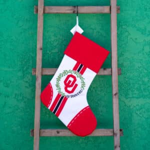University of Oklahoma Christmas Stocking with crimson cuff and OU logo in the center for Holiday decoration and gift for students, fans and alumni